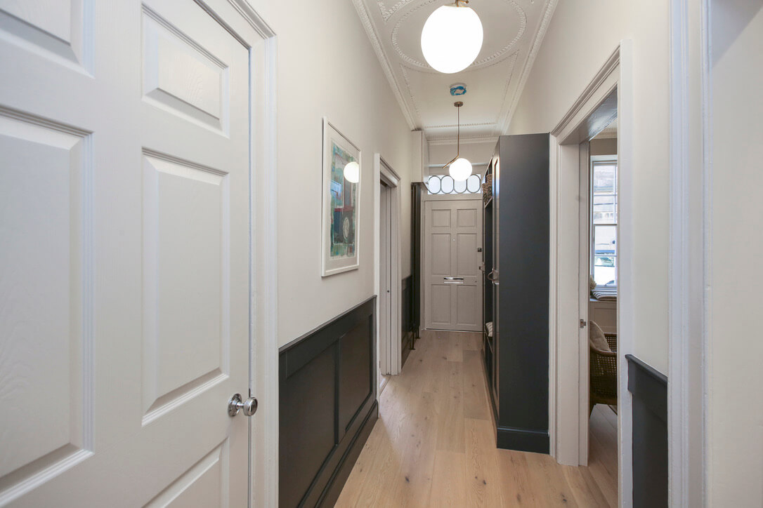Hallway with bespoke panelling and storage unit